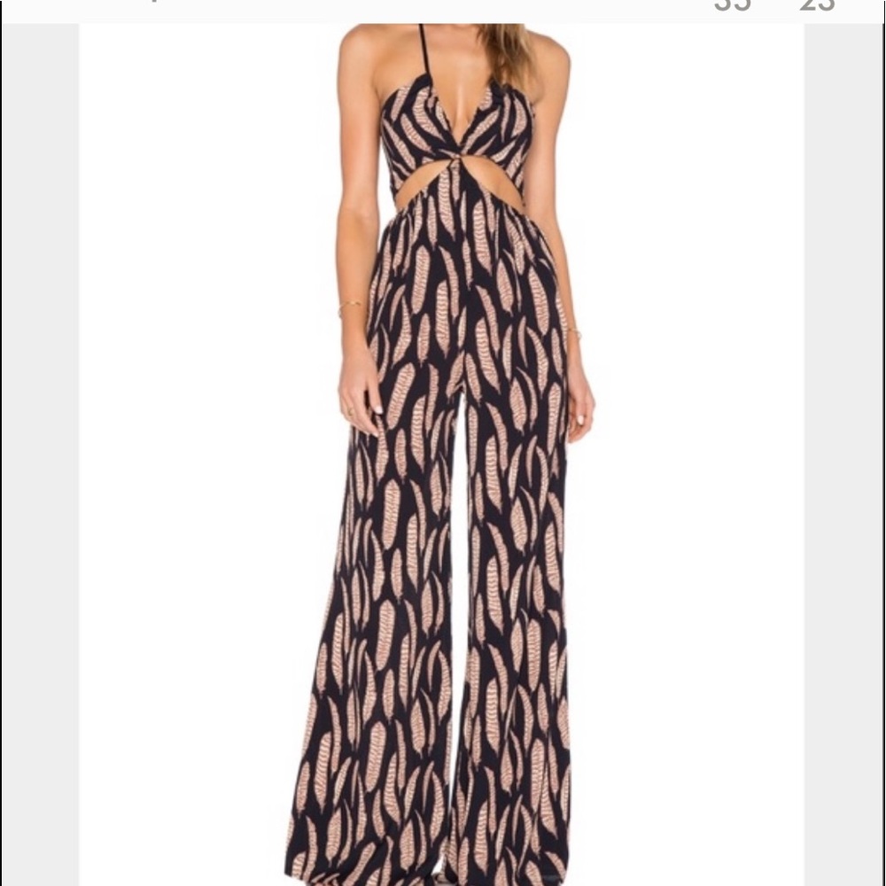 Jumpsuit is Red color shown in picture 2 Coachella
